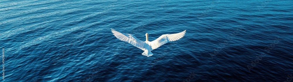 The image captures a striking bird with outstretched wings soaring gracefully above a deep, textured ocean, evoking a sense of freedom and tranquility. The image captures a striking bird with outstretched wings soaring gracefully above a deep, textured ocean, evoking a sense of freedom and tranquility.