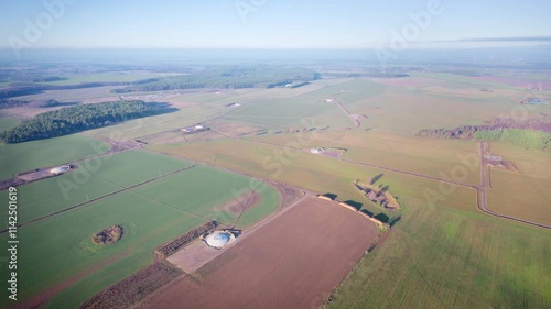 Drone video of multiple wind turbine foundations scattered across the landscape, showcasing the early stages of renewable energy infrastructure in a scenic setting.