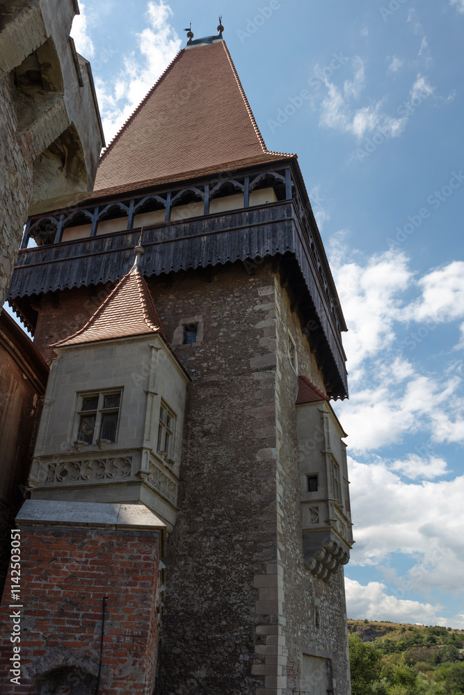 Fototapeta premium Romania Corvin Castle on a cloudy summer day