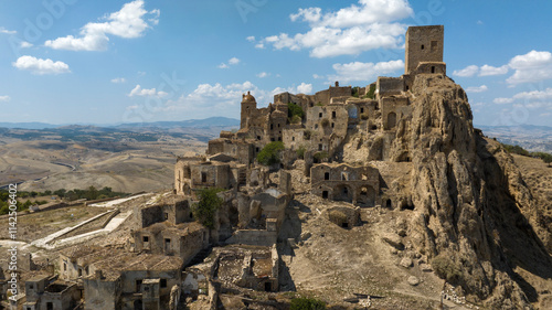 Skyline of Craco, a ghost town in the province of Matera, Basilicata, Italy. The historic center was depopulated due to a landslide and has become a tourist destination.