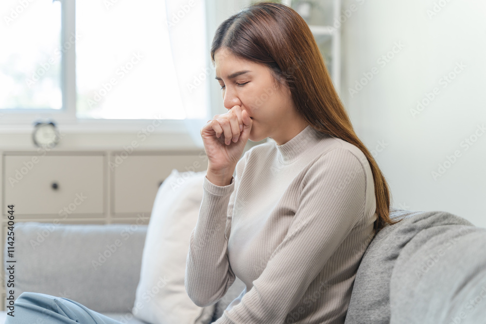 Female unhealthy Sickness, asian young woman, girl unwell and coughing, have cold, sore throat isolated white background suffering with symptom cough feeling bad. Healthcare of Coronavirus, covid-19. Female unhealthy Sickness, asian young woman, girl unwell and coughing, have cold, sore throat isolated white background suffering with symptom cough feeling bad. Healthcare of Coronavirus, covid-19.