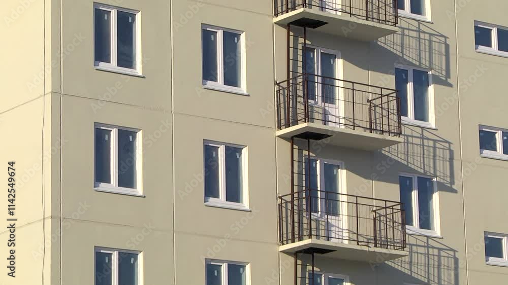 New building with apartments, balconies with fire escapes. New building with apartments, balconies with fire escapes.