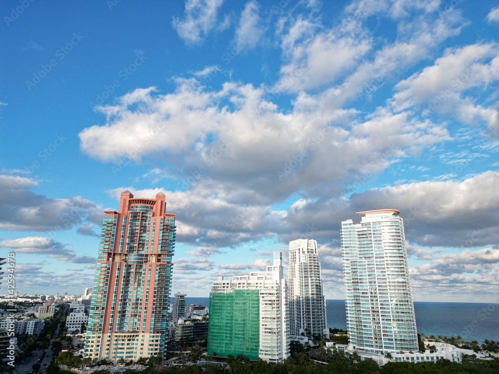 Obraz premium Miami South beach landscape on dramatic sky. Aerial on Miami skyscraper architecture. Aerial Miami south beach. Cityscape landscape in South Beach. Florida panorama. Skyscraper architecture of Miami