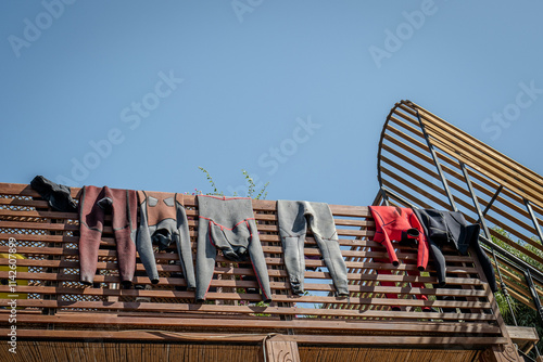 Wetsuits hung out to dry
