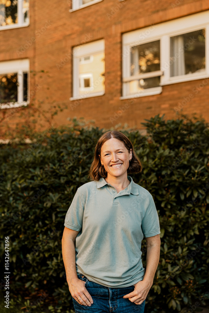 Portrait of smiling female nurse standing with hands in pockets Portrait of smiling female nurse standing with hands in pockets