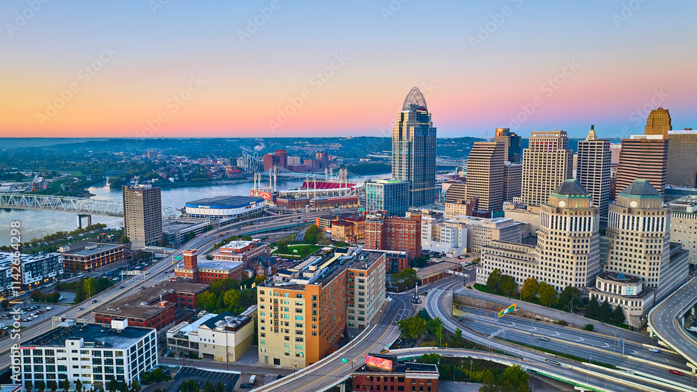 Fototapeta premium Aerial of Cincinnati Skyline at Sunrise with Ohio River and Highways