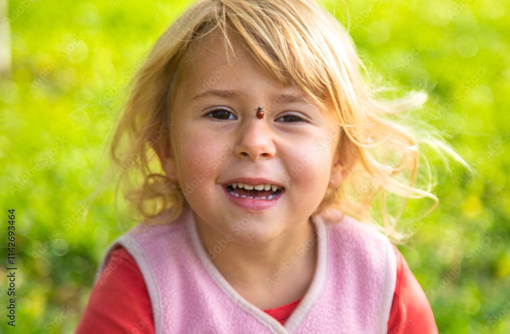 Child playing with ladybug. Selective focus. Child playing with ladybug. Selective focus.