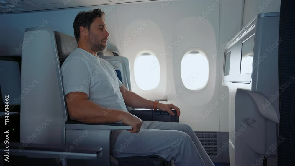 Scared Male Passenger Looking Out The Window Airplane. Man having a panic attack during flight. Flying anxiety or flight phobia concept. man passenger afraid and feeling bad during the flight in plane Scared Male Passenger Looking Out The Window Airplane. Man having a panic attack during flight. Flying anxiety or flight phobia concept. man passenger afraid and feeling bad during the flight in plane