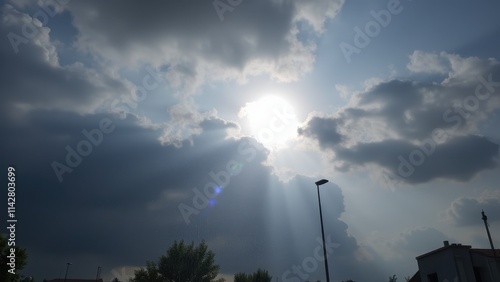 A dramatic weather transition: heavy rain turning into soft snowfall, with clouds parting to reveal the sun peeking through