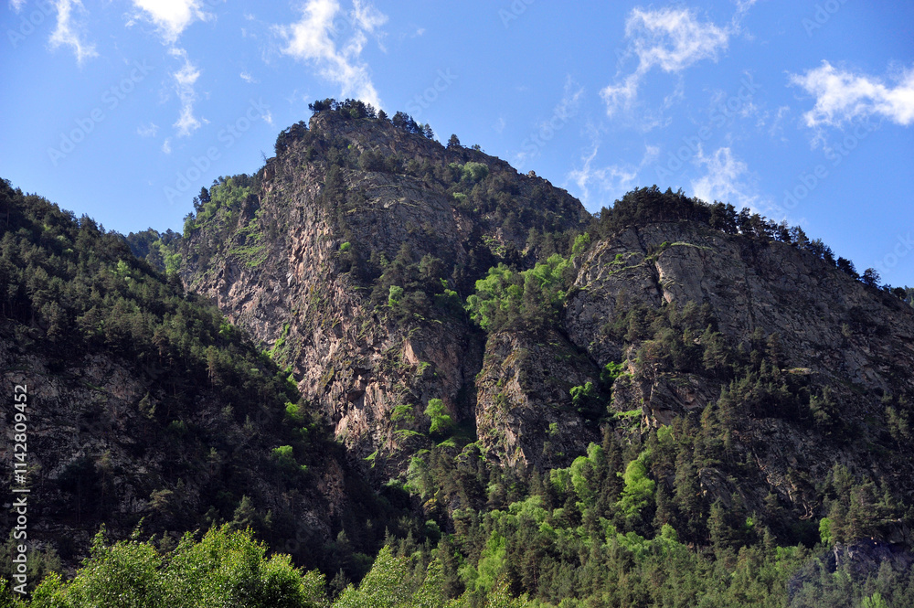 Incredible cliffs rising to the sky create the unique charm of the Baksan Gorge. Incredible cliffs rising to the sky create the unique charm of the Baksan Gorge.