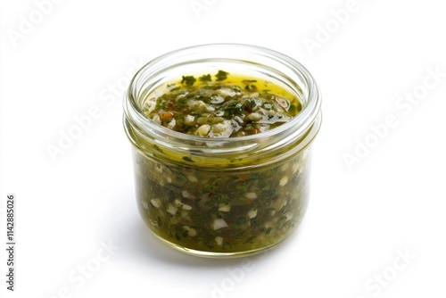 A jar filled with green pesto sauce, perfect for pasta dishes and more