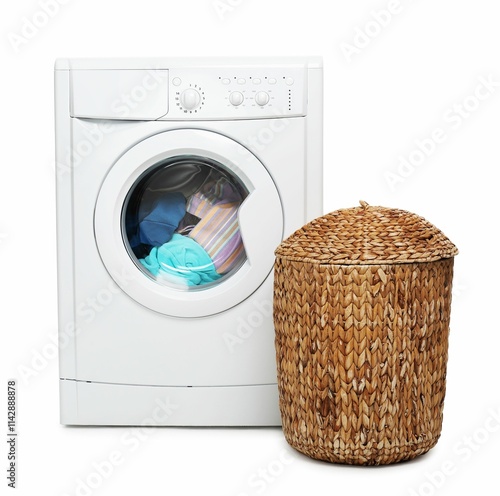 Modern washing machine and laundry basket isolated on white photo