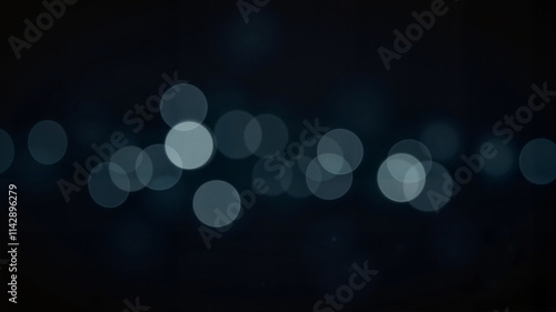 Abstract bokeh effect with blurred lights in dark background