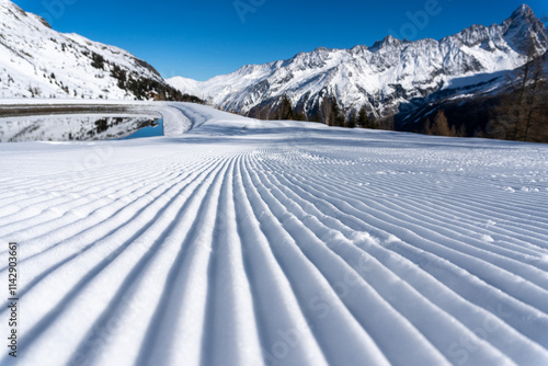 Preparations for the start of the ski season, grooming the pistes for skiers.
