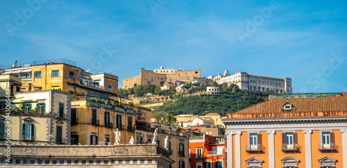 View of Naples from the Piazza del Plebiscito with the historical ruins of Sant'Elmo castle (XII century) at the top of Vomero hill, Naples, Campania, Italy photo