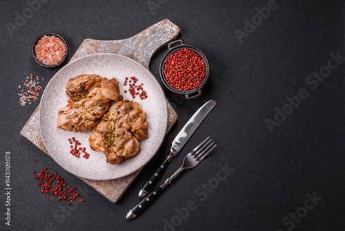 Tableau sur toile Grilled boneless chicken thigh with salt, spices and herbs