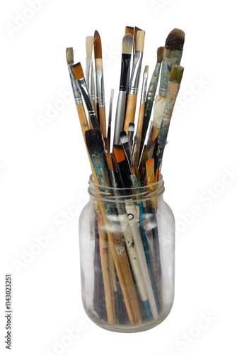 Various professional paint brushes in the glass jar, isolated on white background