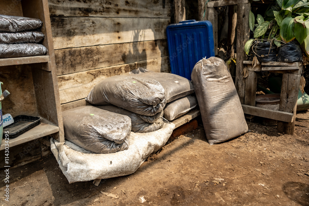 Compost Bags in a Wooden Shelf in a Plant Nursery in Sustainable Farming Setup