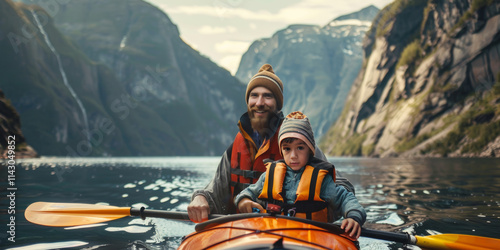 Father and son floating in kayak on a sea bay with fjords in the background. Family canoe trips on a mountain lake. photo