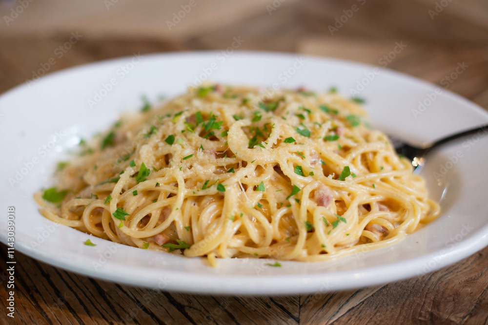 Carbonara pasta, spaghetti with pancetta, egg, hard Parmesan cheese and cream sauce. Traditional Italian cuisine. Pasta alla carbonara. Carbonara pasta, spaghetti with pancetta, egg, hard Parmesan cheese and cream sauce. Traditional Italian cuisine. Pasta alla carbonara.