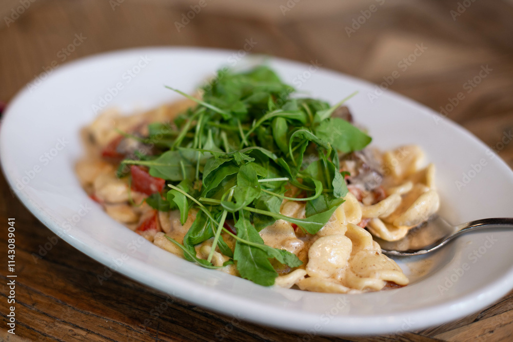 Pasta with meat and arugula. Pasta with meat and arugula.