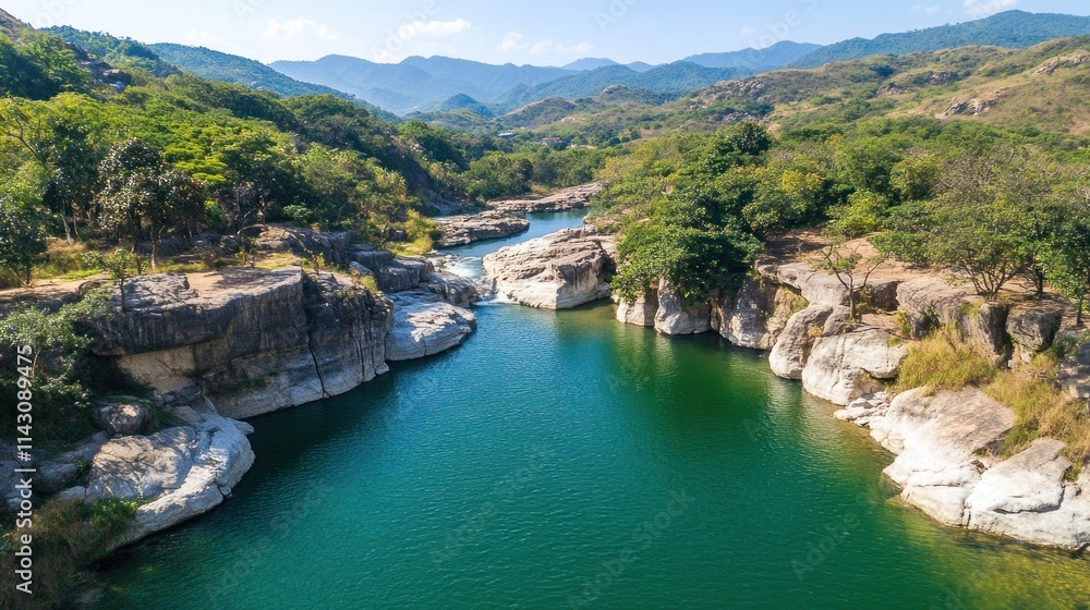 Aerial view of a pristine river flowing through a lush green valley. Aerial view of a pristine river flowing through a lush green valley.