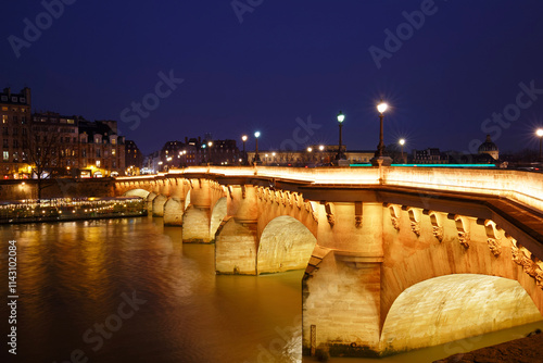 View of the Pont Neuf bridge across the river Seine in Paris, France. photo