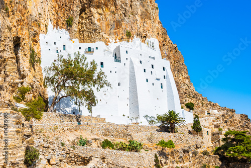 Famous white building of Panagia Hozoviotissa monastery hanging on the cliff side above the sea, Amorgos island, Cyclades, Greece photo