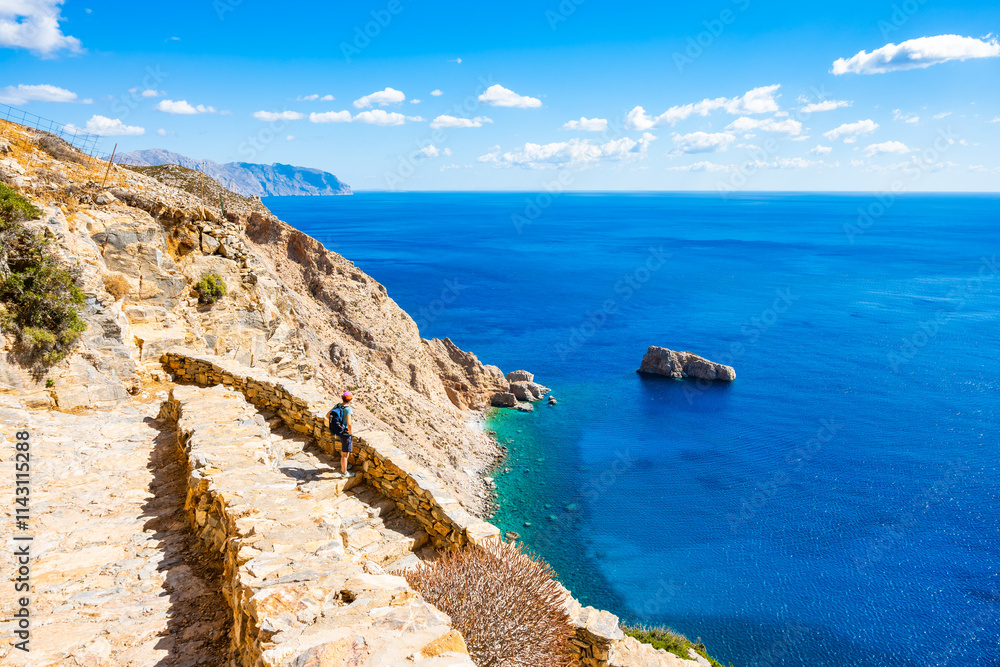 Walking path along sea and high cliffs to Panagia Hozoviotissa monastery, Amorgos island, Cyclades, Greece