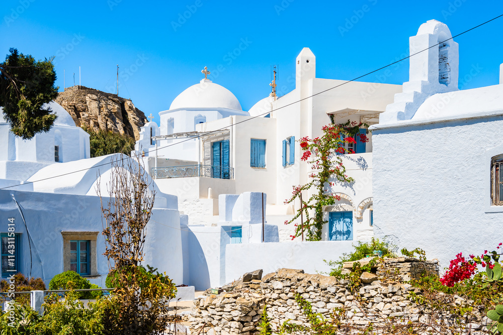 White church in narrow street of Chora village, Amorgos island, Cyclades, Greece