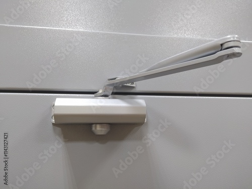 Metal door stop in grey color