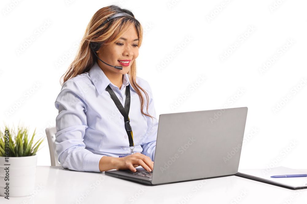 Asian woman working on a laptop computer Asian woman working on a laptop computer