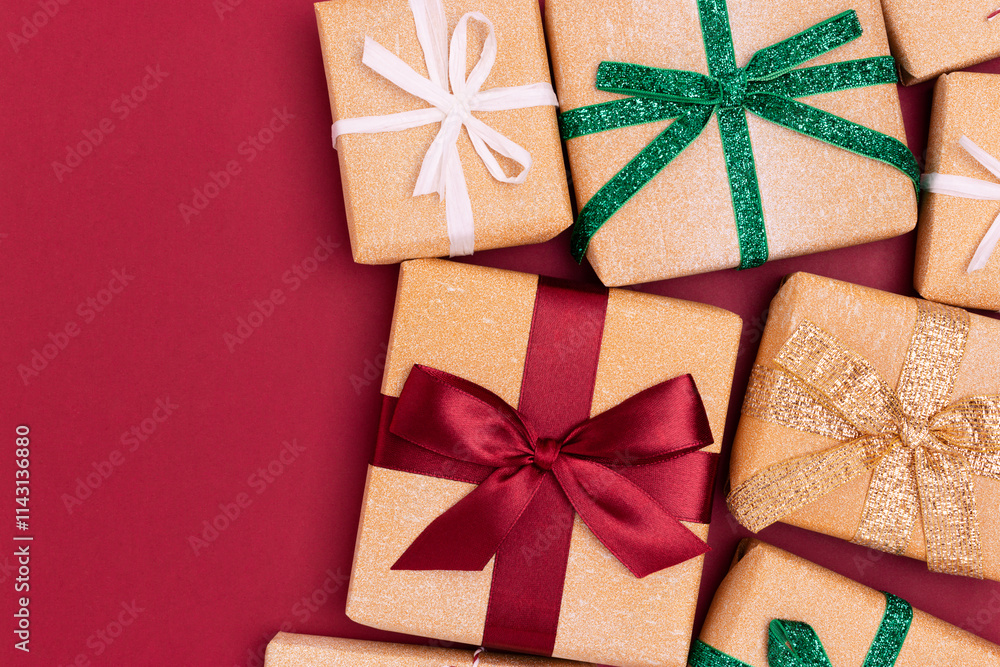 Wrapped gifts on a red background. Boxing day concept with place for text. Wrapped gifts on a red background. Boxing day concept with place for text.