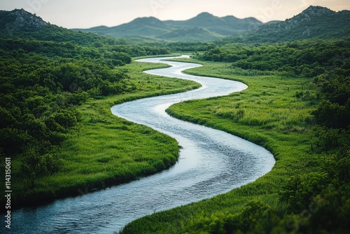 Winding river flows through lush green valley surrounded by distant hills at sunset. Generative AI