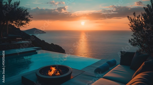 A villa in the ocean with a rooftop infinity pool firepit seating and stunning sunrise views over the horizon. photo