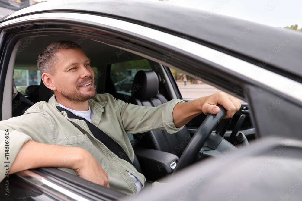Man driving modern car, view through window Man driving modern car, view through window