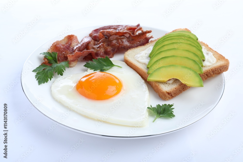 Romantic breakfast with fried bacon, heart shaped egg and avocado toast isolated on white. Valentine's day celebration Romantic breakfast with fried bacon, heart shaped egg and avocado toast isolated on white. Valentine's day celebration