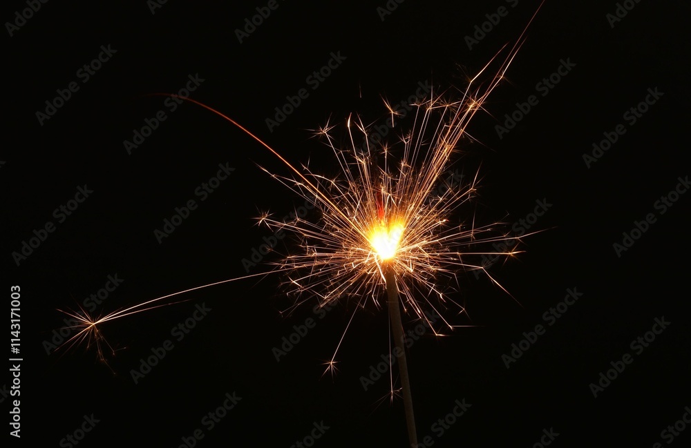 Burning sparkler on black background, space for text Burning sparkler on black background, space for text