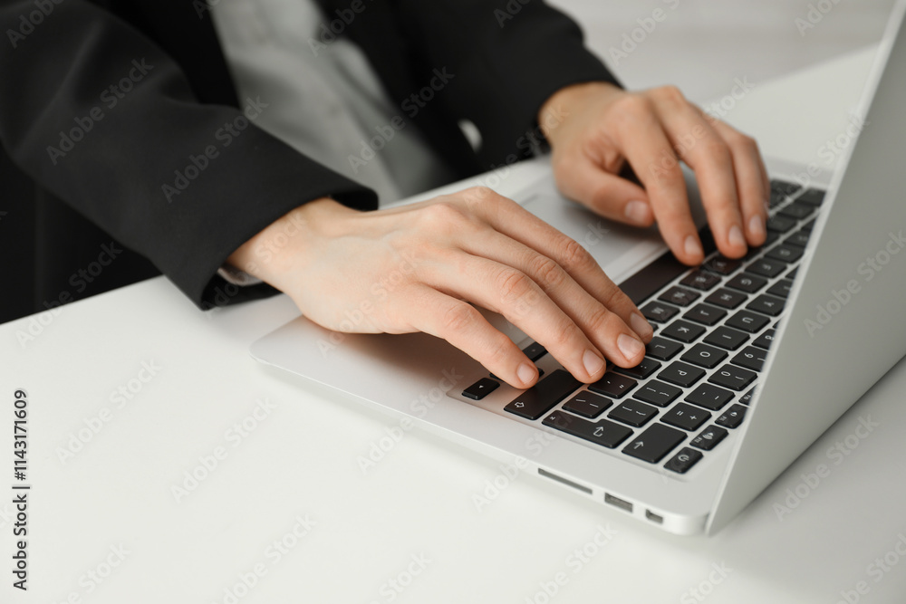 Businesswoman using laptop at white table indoors, closeup. Modern technology Businesswoman using laptop at white table indoors, closeup. Modern technology