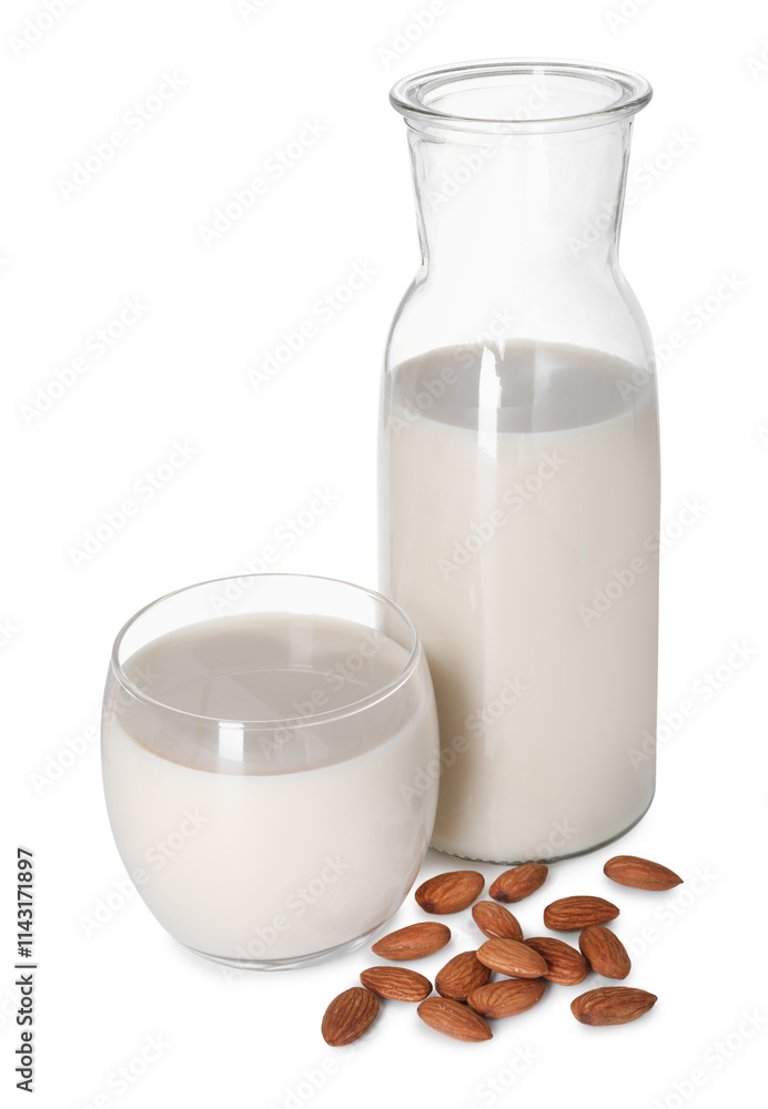Glass and bottle of almond milk and nuts isolated on white Glass and bottle of almond milk and nuts isolated on white