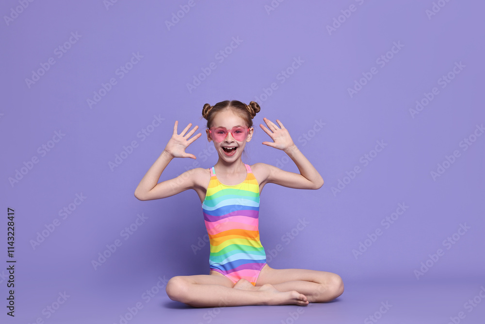 Happy girl in beachwear on purple background Happy girl in beachwear on purple background