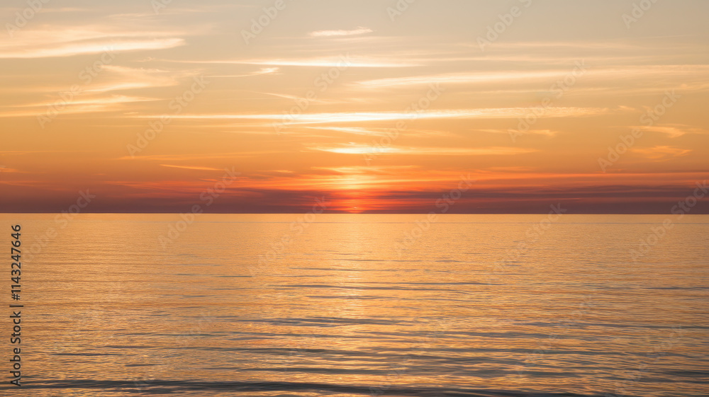 A stunning sunset over calm waters, featuring vibrant orange and yellow hues against a clear sky, creating a serene and tranquil atmosphere. A stunning sunset over calm waters, featuring vibrant orange and yellow hues against a clear sky, creating a serene and tranquil atmosphere.