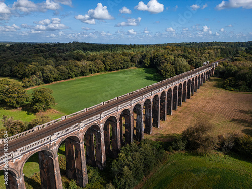 Wallpaper Mural Drone view of historic Ouse Valley train viaduct and its arches in Sussex, England Torontodigital.ca