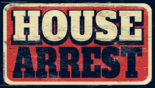 Aged and worn house arrest sign on wood