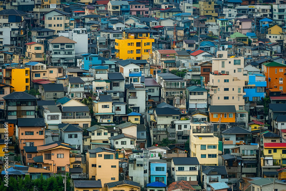 A dense urban landscape showcasing colorful residential buildings and rooftops. A dense urban landscape showcasing colorful residential buildings and rooftops.