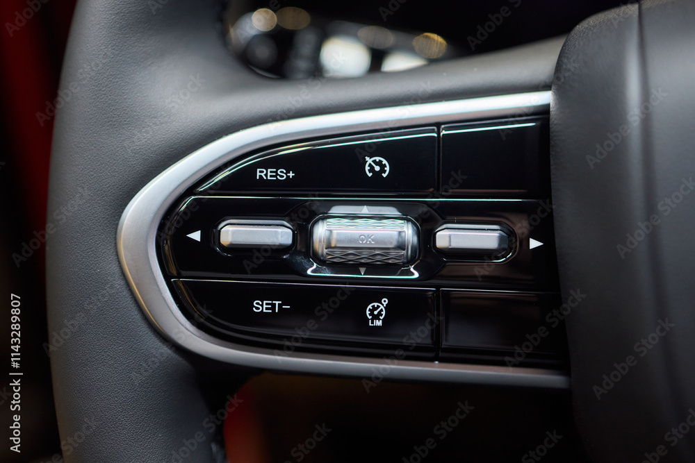 Obraz premium The modern cars steering wheel control panel boosts convenience and performance