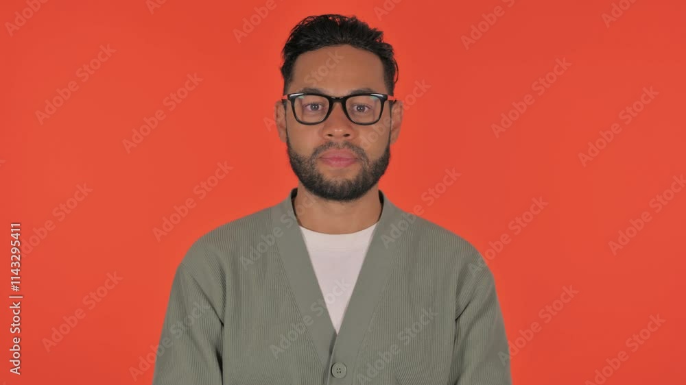 Serious Casual Hispanic Man on Red Background, Portrait Serious Casual Hispanic Man on Red Background, Portrait