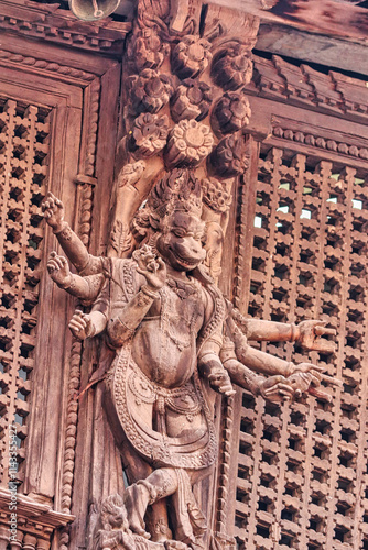 Traditional Nepali Wooden carving of a Hayagriva,Avatar of Vishnu as a sacred horse on the facade of the royal palace of the Malla kings in Kathmandu's Durbar square  photo