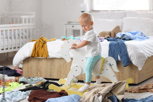 Naughty baby boy on rocking...