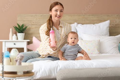 Mother with bottle of milk ...